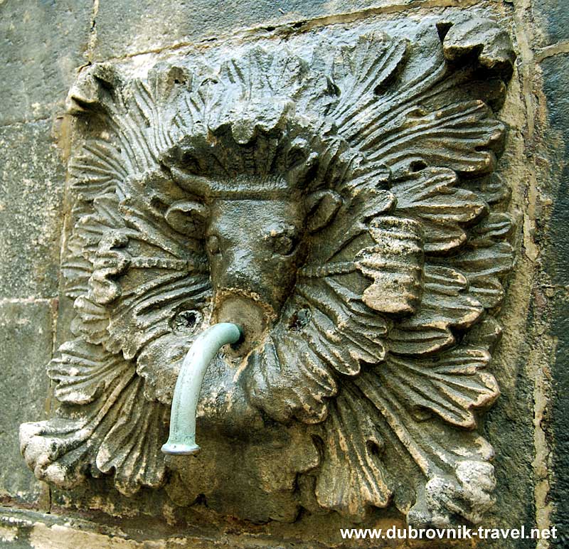 Carved Mask at Onofrio's Fountain