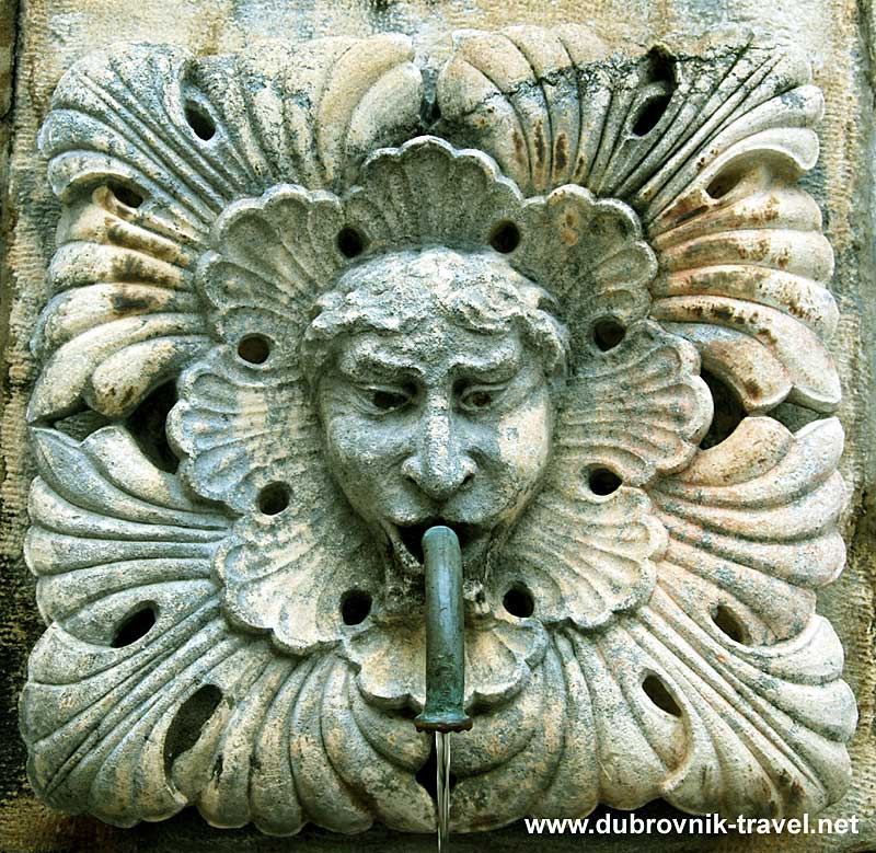 Carved Masks at Onofrio's Fountain